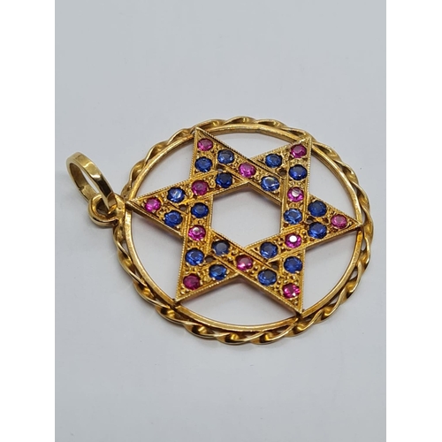 401 - 18k Yellow Gold Ruby and Sapphire Star of David Pendant. 15 Rubies and 15 Sapphires complete this wo... 