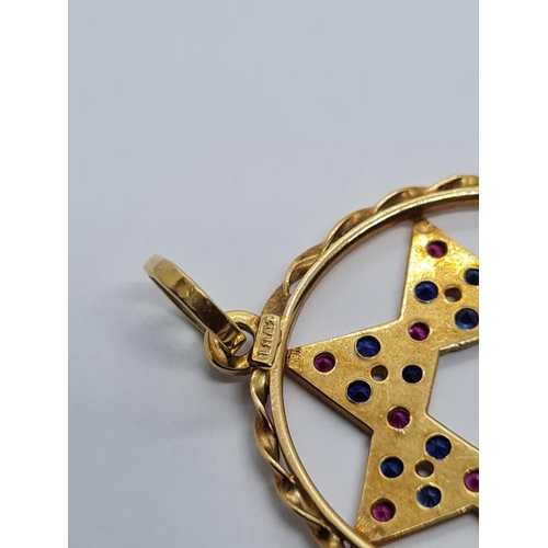 401 - 18k Yellow Gold Ruby and Sapphire Star of David Pendant. 15 Rubies and 15 Sapphires complete this wo... 