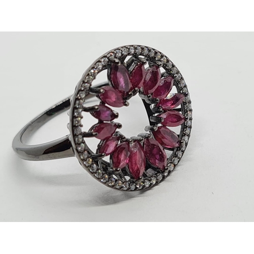 947 - Black 925 Sterling Silver Ring set with Marquise Cut Rubies. Size P.