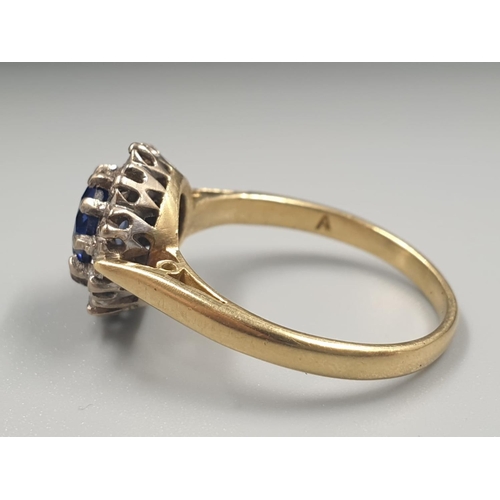 855 - 18ct yellow gold sapphire and diamond cluster ring, weight 3.79g and size N