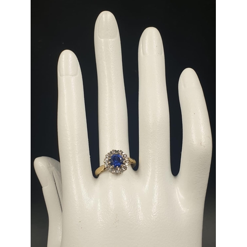 855 - 18ct yellow gold sapphire and diamond cluster ring, weight 3.79g and size N