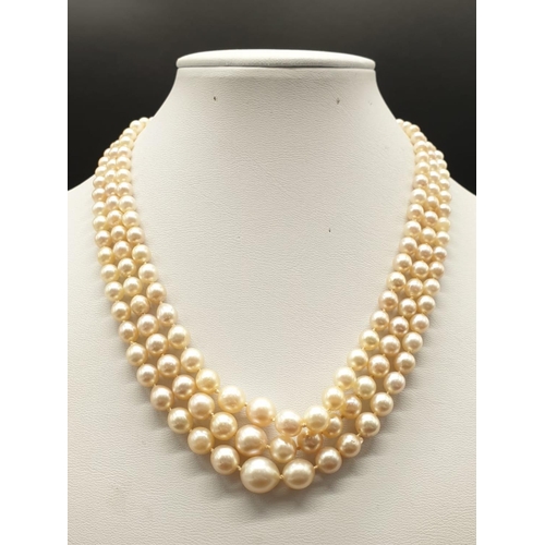 337 - A 3 ROW GRADUATED PEARL NECKLACE WITH PLATINUM AND DIAMOND CLASP  48gms and 18cms in length