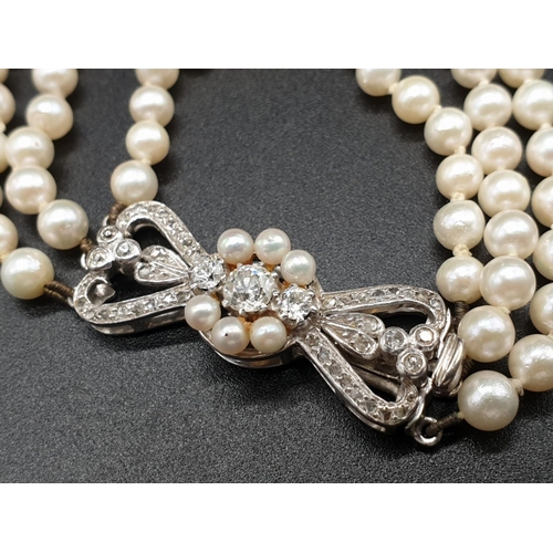 337 - A 3 ROW GRADUATED PEARL NECKLACE WITH PLATINUM AND DIAMOND CLASP  48gms and 18cms in length