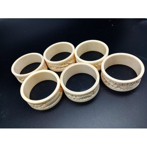 542 - Six Antique Ivory Hand-Carved with Chinese Decoration Napkin Rings. 5cm diameter.