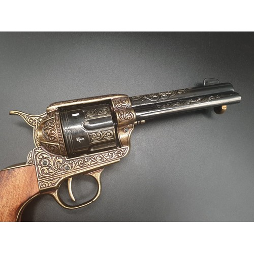 549 - Replica Colt 45. The Gun that won the West!
Fully Engraved 1869 Colt, with wooden handle. Dry firing... 