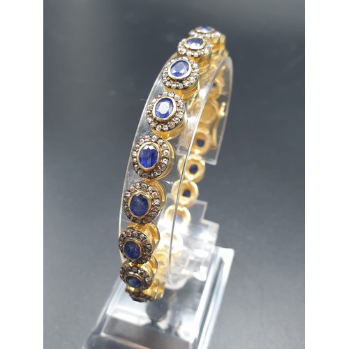 105 - A 925 Silver Gold Plated Bracelet with 4.90ct of 20 pieces of Transparent Blue Oval Faceted Sapphire... 