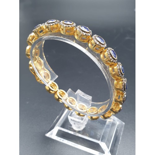 105 - A 925 Silver Gold Plated Bracelet with 4.90ct of 20 pieces of Transparent Blue Oval Faceted Sapphire... 