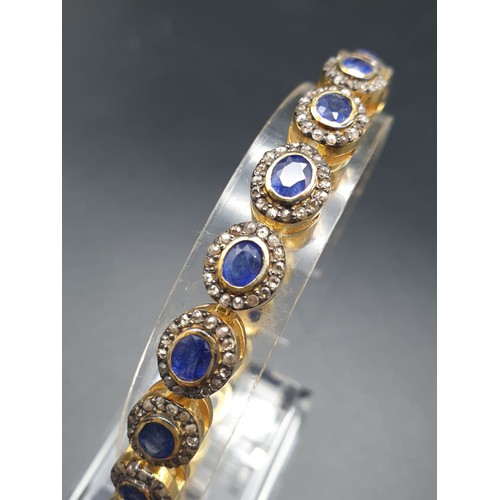 105 - A 925 Silver Gold Plated Bracelet with 4.90ct of 20 pieces of Transparent Blue Oval Faceted Sapphire... 