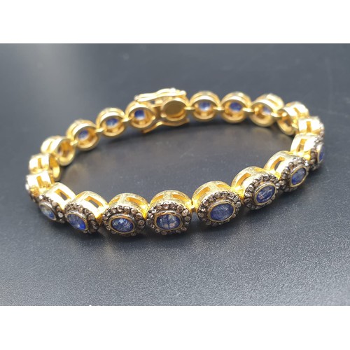 105 - A 925 Silver Gold Plated Bracelet with 4.90ct of 20 pieces of Transparent Blue Oval Faceted Sapphire... 