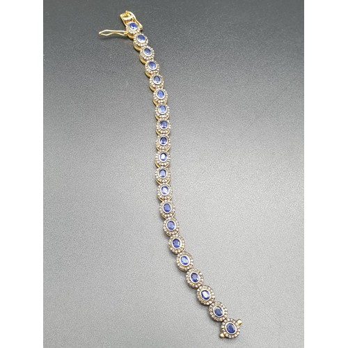 105 - A 925 Silver Gold Plated Bracelet with 4.90ct of 20 pieces of Transparent Blue Oval Faceted Sapphire... 