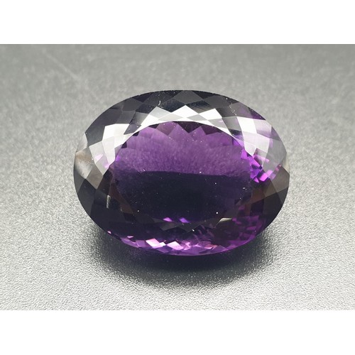 133 - A Natural Purple Amethyst in Oval Faceted. Total 69.69ct
28.80 x 22.00 x 16.75mm. Come with AIG Cert... 