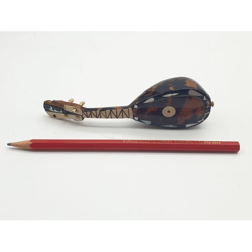 746 - Victorian tortoise shell decorated on wood ornament in the form of musical instrument