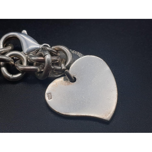 328 - Silver Bracelet with Two Tiffany Heart Charms. 18cm.
31g total weight.