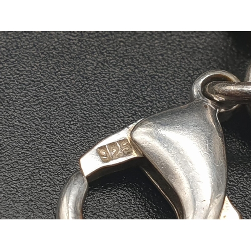 328 - Silver Bracelet with Two Tiffany Heart Charms. 18cm.
31g total weight.