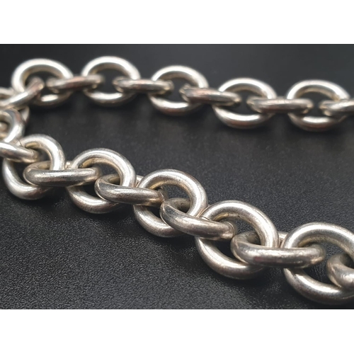 328 - Silver Bracelet with Two Tiffany Heart Charms. 18cm.
31g total weight.