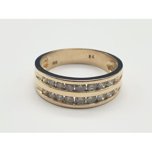 303 - 18K Yellow Gold Two-Row Diamond Ring. 0.75 Carats.
4.5g. Size P.