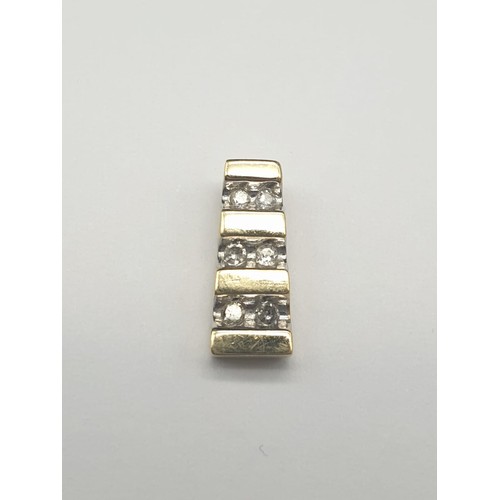 325 - 9K Yellow Gold Three- Diamond Pendant.
.64g.