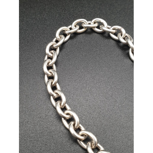 337 - Tiffany style Silver link Bracelet with Heart Pendant.
17cm. 18.25g