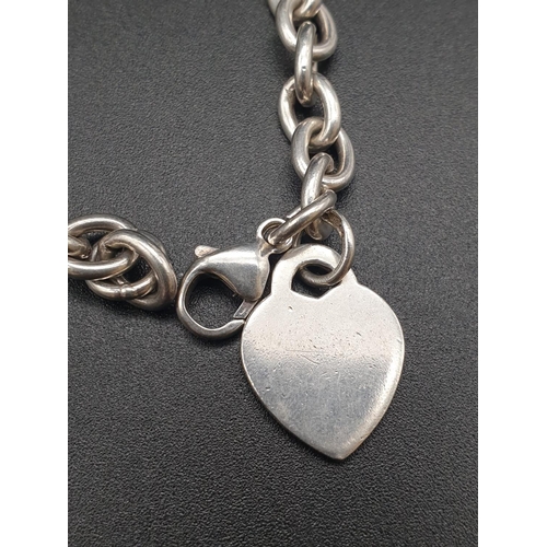 337 - Tiffany style Silver link Bracelet with Heart Pendant.
17cm. 18.25g