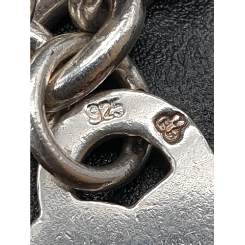 337 - Tiffany style Silver link Bracelet with Heart Pendant.
17cm. 18.25g