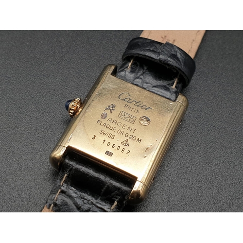 15 - Must de Cartier ladies wristwatch with black square face, gold plate and leather strap, 26mm x 20mm