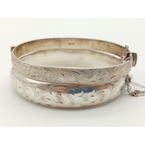 330 - Two Silver Bangles. 5 1/2 and 6cm diameter. 40g