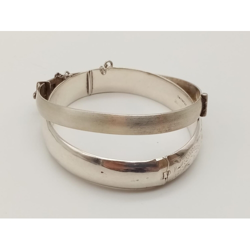 330 - Two Silver Bangles. 5 1/2 and 6cm diameter. 40g