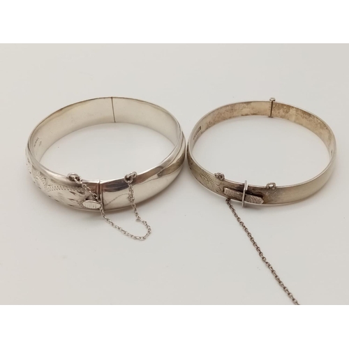 330 - Two Silver Bangles. 5 1/2 and 6cm diameter. 40g