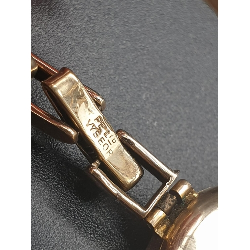 39 - Vintage, possibly Antique 9k Yellow Gold Ladies Watch.
Expandable strap. Gold Dial. As Found. 18g
