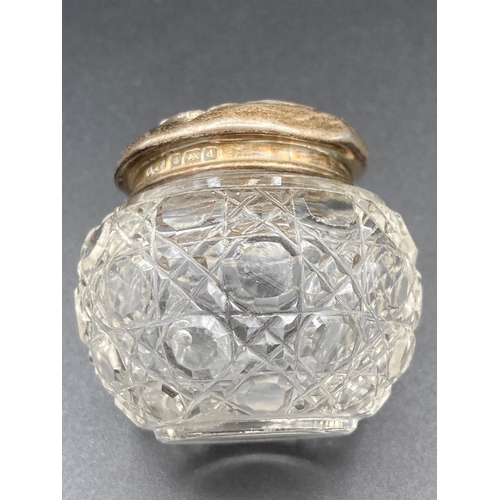 327 - Silver topped cut glass Rouge pot having clear hallmark for Levi and Salaman Birmingham 1904. Repous... 