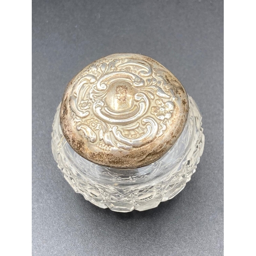 327 - Silver topped cut glass Rouge pot having clear hallmark for Levi and Salaman Birmingham 1904. Repous... 