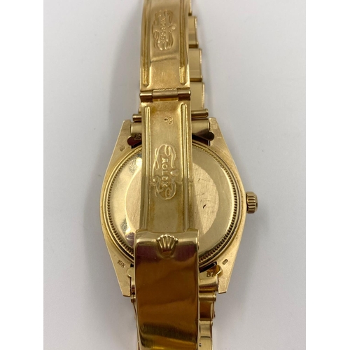 22 - AN 18K GOLD ROLEX OYSTER PERPETUAL WITH DATE BOX AND WHITE FACE. 36MM