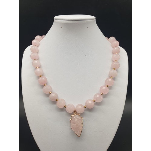 105 - A highly unusual necklace, bracelet and earrings set of large beaded rose quartz adorned with neolit... 