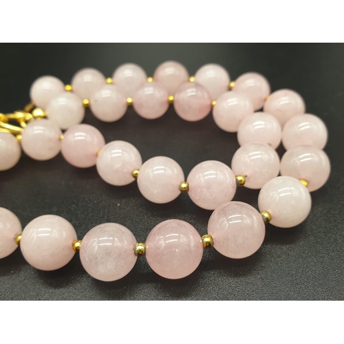 105 - A highly unusual necklace, bracelet and earrings set of large beaded rose quartz adorned with neolit... 