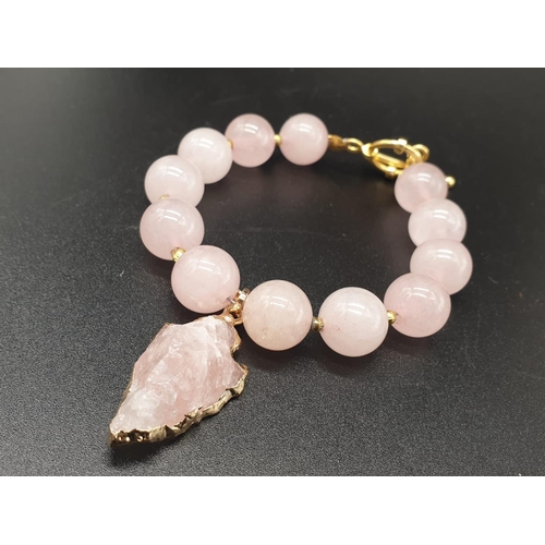 105 - A highly unusual necklace, bracelet and earrings set of large beaded rose quartz adorned with neolit... 