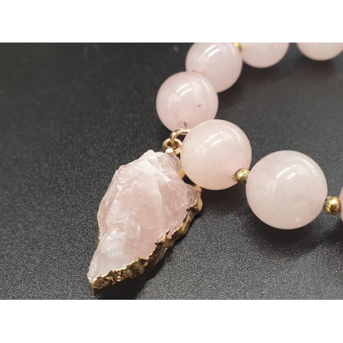 105 - A highly unusual necklace, bracelet and earrings set of large beaded rose quartz adorned with neolit... 