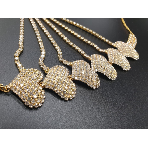 140 - A highly glamorous asymmetric necklace and matching earrings in a presentation box. With glittering ... 