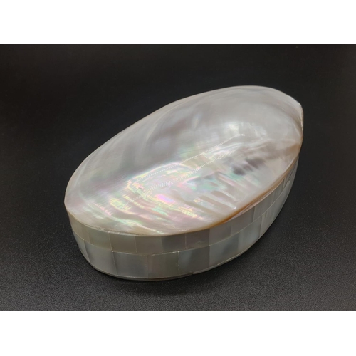 189 - A vintage and very pretty mother of pearl box, revealing – when opened – an even prettier necklace a... 