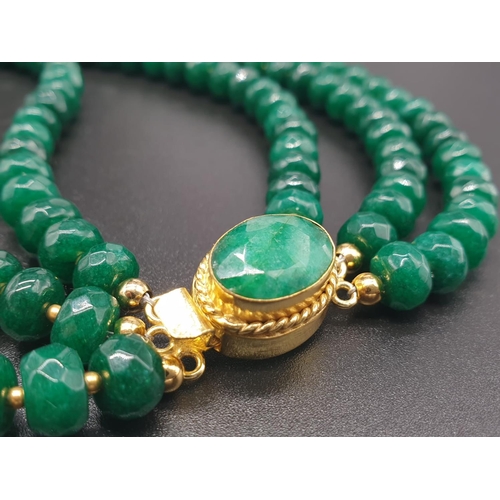 50 - A beautiful and substantial three row necklace of faceted emeralds with accents of large natural pea... 