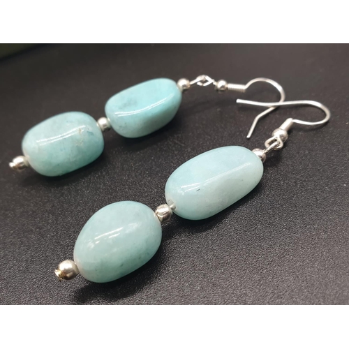 64 - A very attractive and unique looking LARIMAR necklace, bracelet and earrings set in a presentation b... 