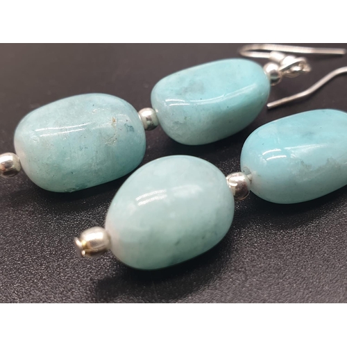 64 - A very attractive and unique looking LARIMAR necklace, bracelet and earrings set in a presentation b... 