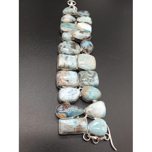 64 - A very attractive and unique looking LARIMAR necklace, bracelet and earrings set in a presentation b... 