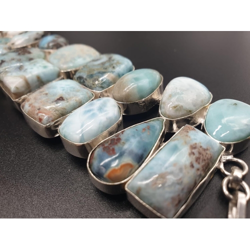 64 - A very attractive and unique looking LARIMAR necklace, bracelet and earrings set in a presentation b... 