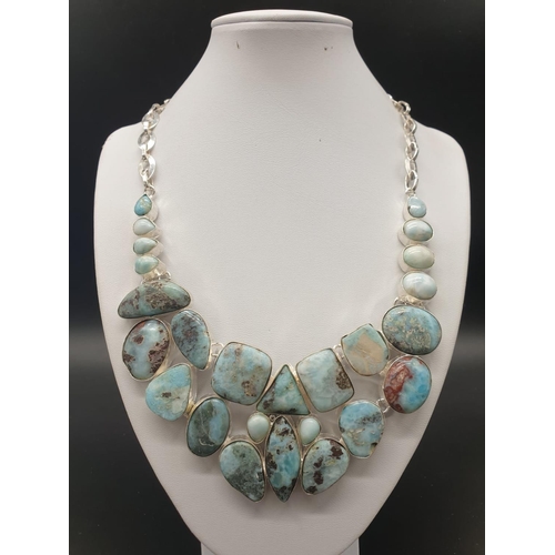 64 - A very attractive and unique looking LARIMAR necklace, bracelet and earrings set in a presentation b... 