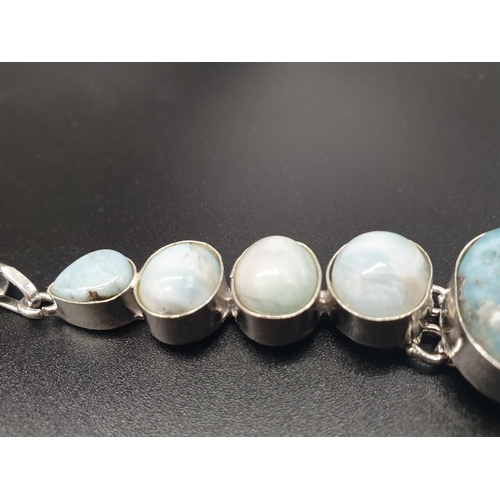 64 - A very attractive and unique looking LARIMAR necklace, bracelet and earrings set in a presentation b... 