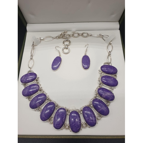 78 - A rare and beautiful, white metal (untested) RUSSIAN CHAROITE necklace and earrings set in a present... 