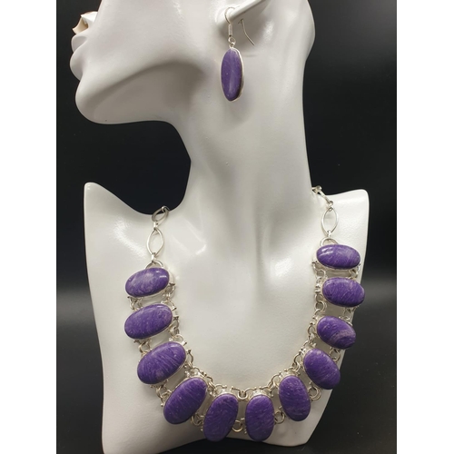 78 - A rare and beautiful, white metal (untested) RUSSIAN CHAROITE necklace and earrings set in a present... 