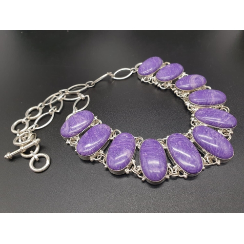 78 - A rare and beautiful, white metal (untested) RUSSIAN CHAROITE necklace and earrings set in a present... 