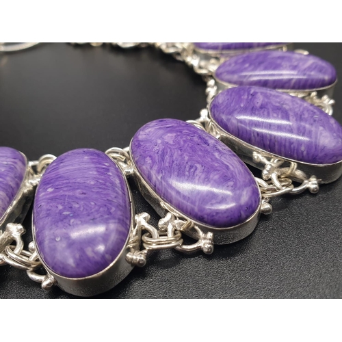 78 - A rare and beautiful, white metal (untested) RUSSIAN CHAROITE necklace and earrings set in a present... 