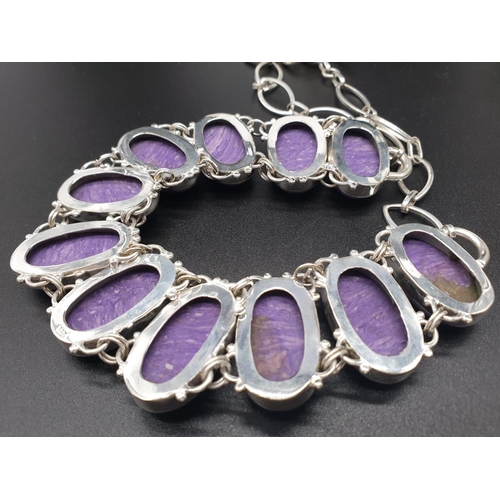 78 - A rare and beautiful, white metal (untested) RUSSIAN CHAROITE necklace and earrings set in a present... 